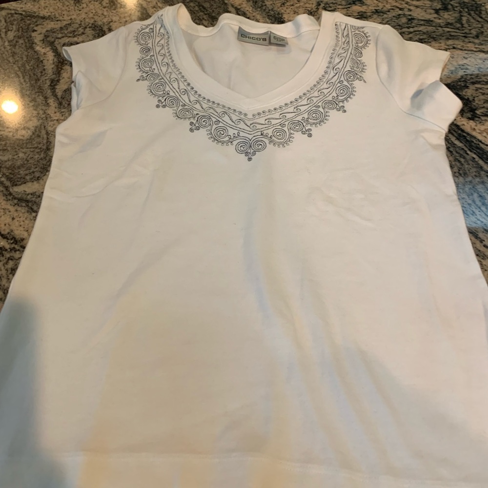 Chicos v-neck , short sleeve ,white shirt with embroidered black design.